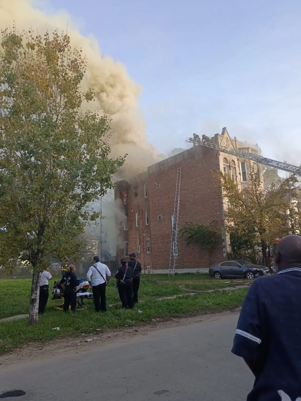 Daytime smoke behind the building