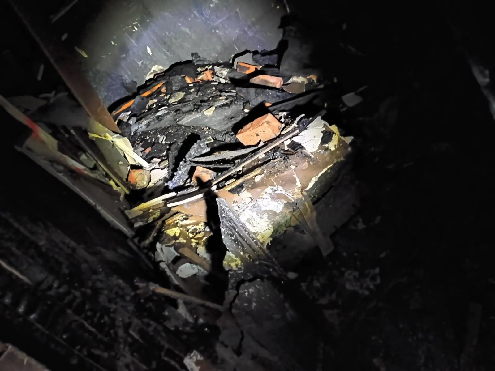 Another room with rubble and fire damage